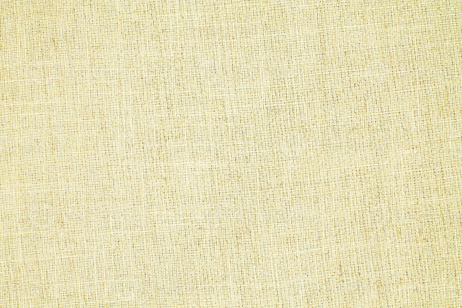 Natural Linen Material Textile Canvas Fabric Texture Background Close-up Detail of Fabric Natural Color Hemp Material Pattern Design Wallpaper. Can be Used as Background or For Graphic Design photo