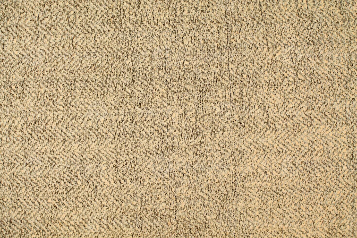 Natural Linen Material Textile Canvas Fabric Texture Background Close-up Detail of Fabric Natural Color Hemp Material Pattern Design Wallpaper. Can be Used as Background or For Graphic Design photo