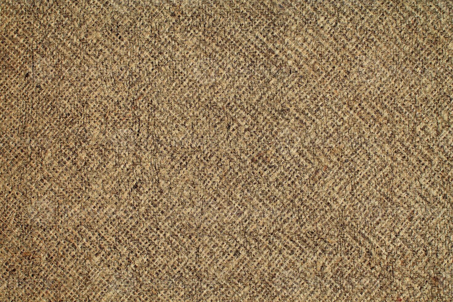 Natural Linen Material Textile Canvas Fabric Texture Background Close-up Detail of Fabric Natural Color Hemp Material Pattern Design Wallpaper. Can be Used as Background or For Graphic Design photo