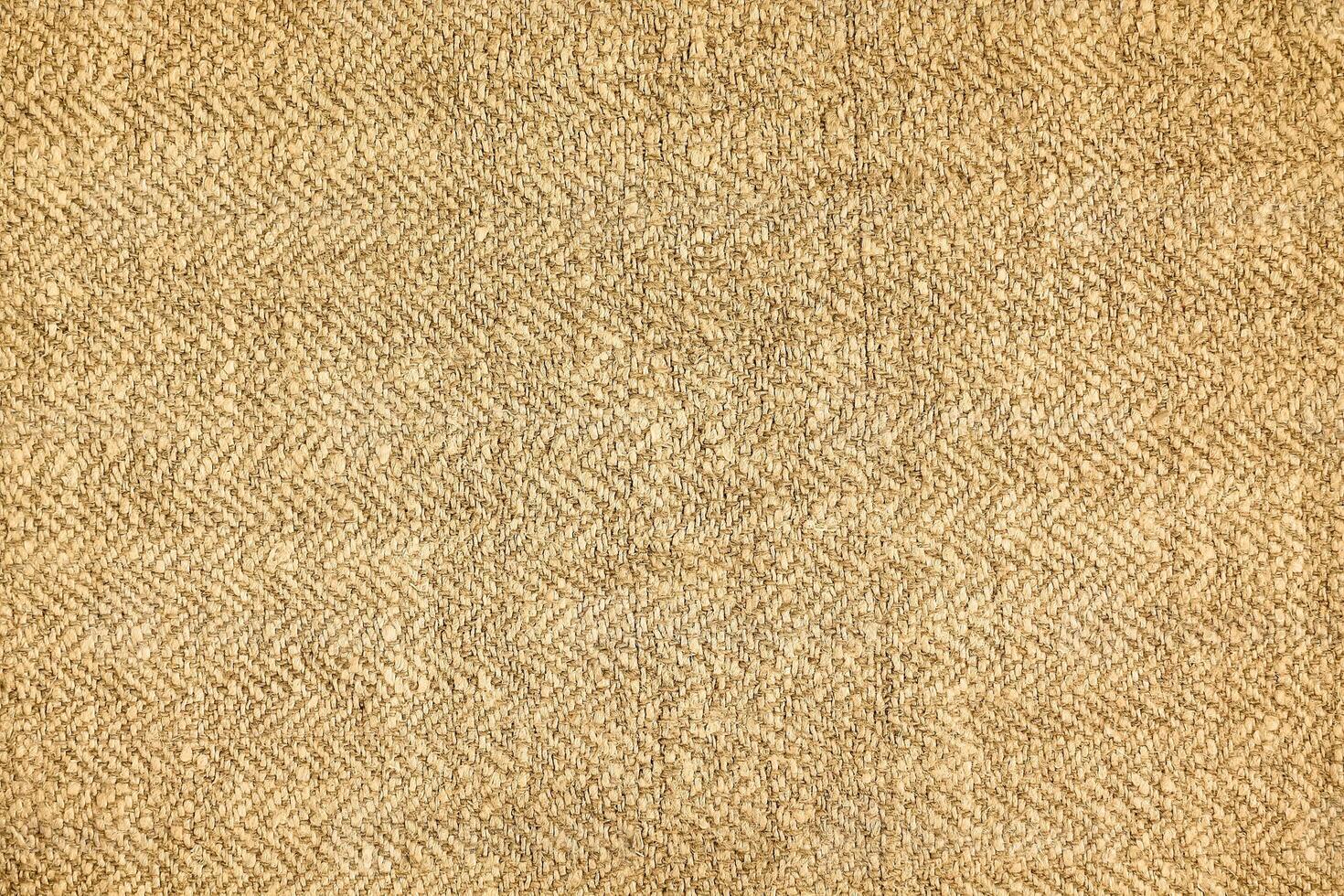 Natural Linen Material Textile Canvas Fabric Texture Background Close-up Detail of Fabric Natural Color Hemp Material Pattern Design Wallpaper. Can be Used as Background or For Graphic Design photo
