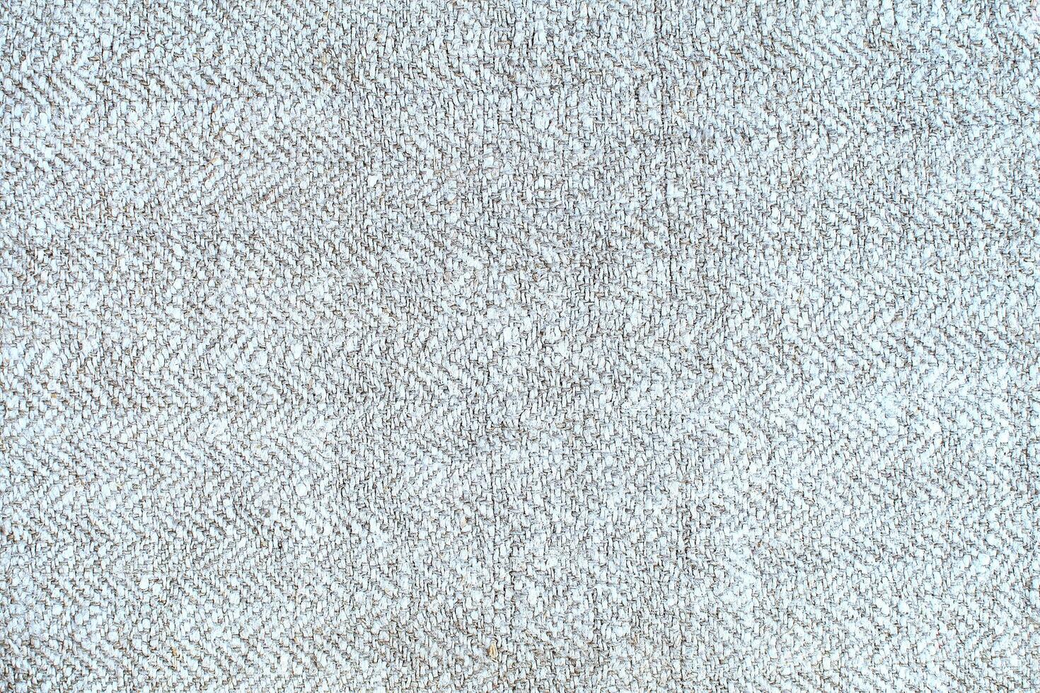Natural Linen Material Textile Canvas Fabric Texture Background Close-up Detail of Fabric Natural Color Hemp Material Pattern Design Wallpaper. Can be Used as Background or For Graphic Design photo