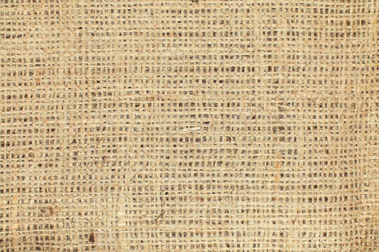 Natural Linen Material Textile Canvas Fabric Texture Background Close-up Detail of Fabric Natural Color Hemp Material Pattern Design Wallpaper. Can be Used as Background or For Graphic Design photo