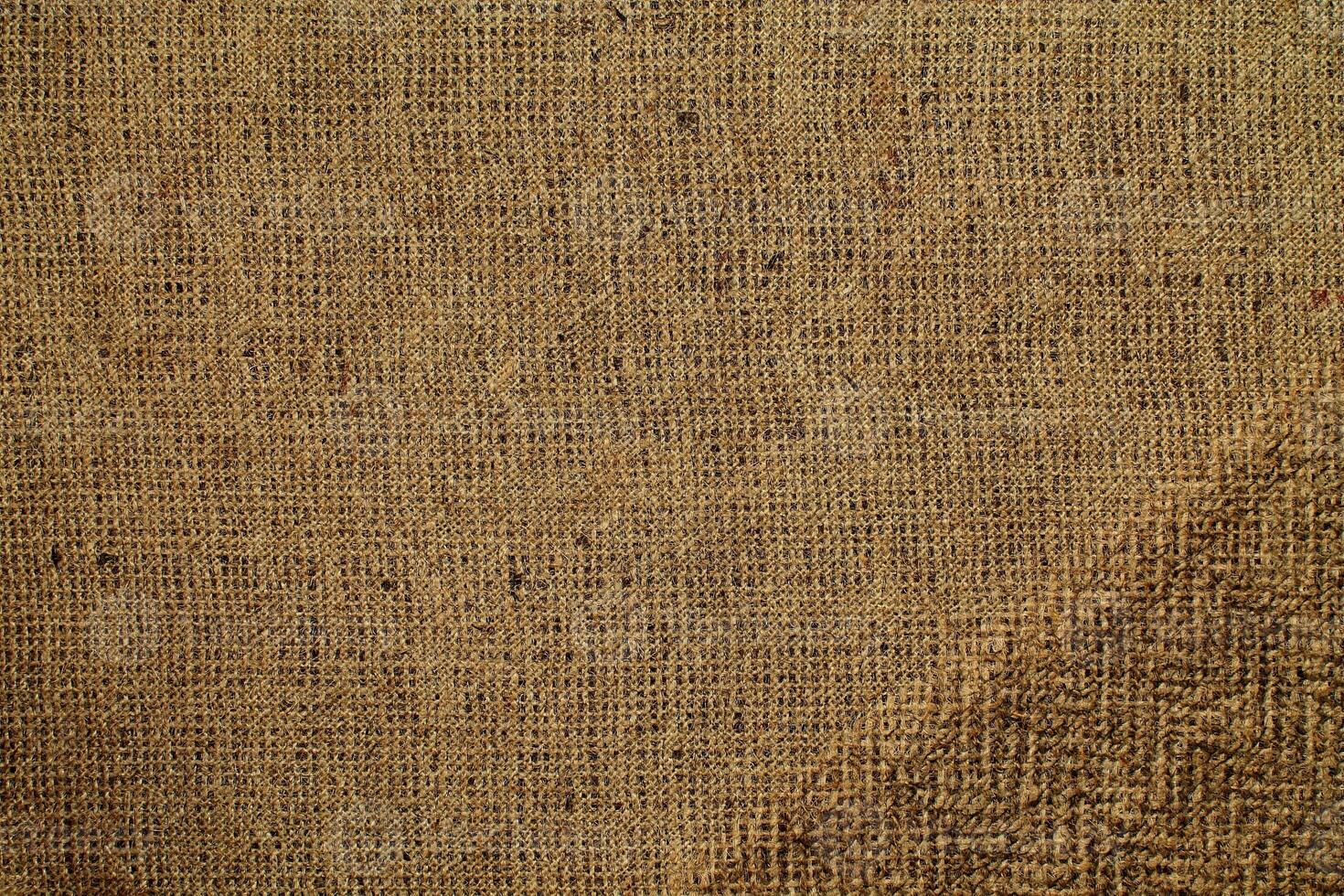 Natural Linen Material Textile Canvas Fabric Texture Background Close-up Detail of Fabric Natural Color Hemp Material Pattern Design Wallpaper. Can be Used as Background or For Graphic Design photo