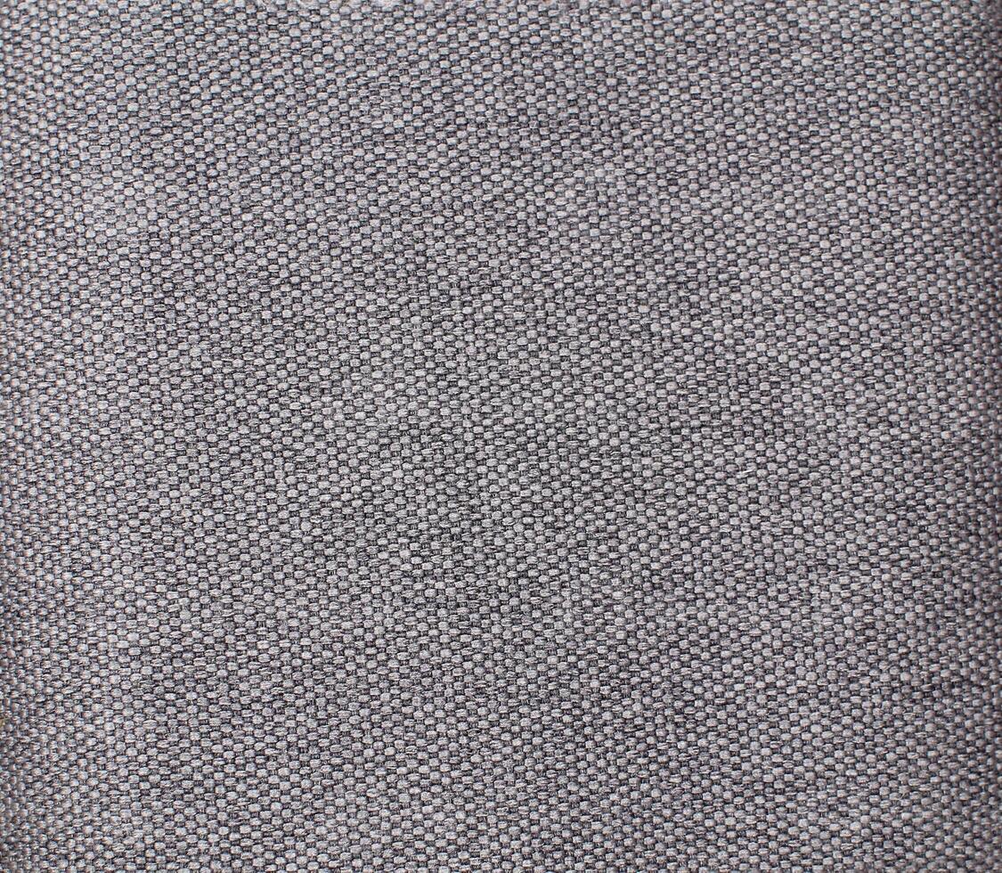 Natural Linen Material Textile Canvas Fabric Texture Background Close-up Detail of Fabric Natural Color Hemp Material Pattern Design Wallpaper. Can be Used as Background or For Graphic Design photo