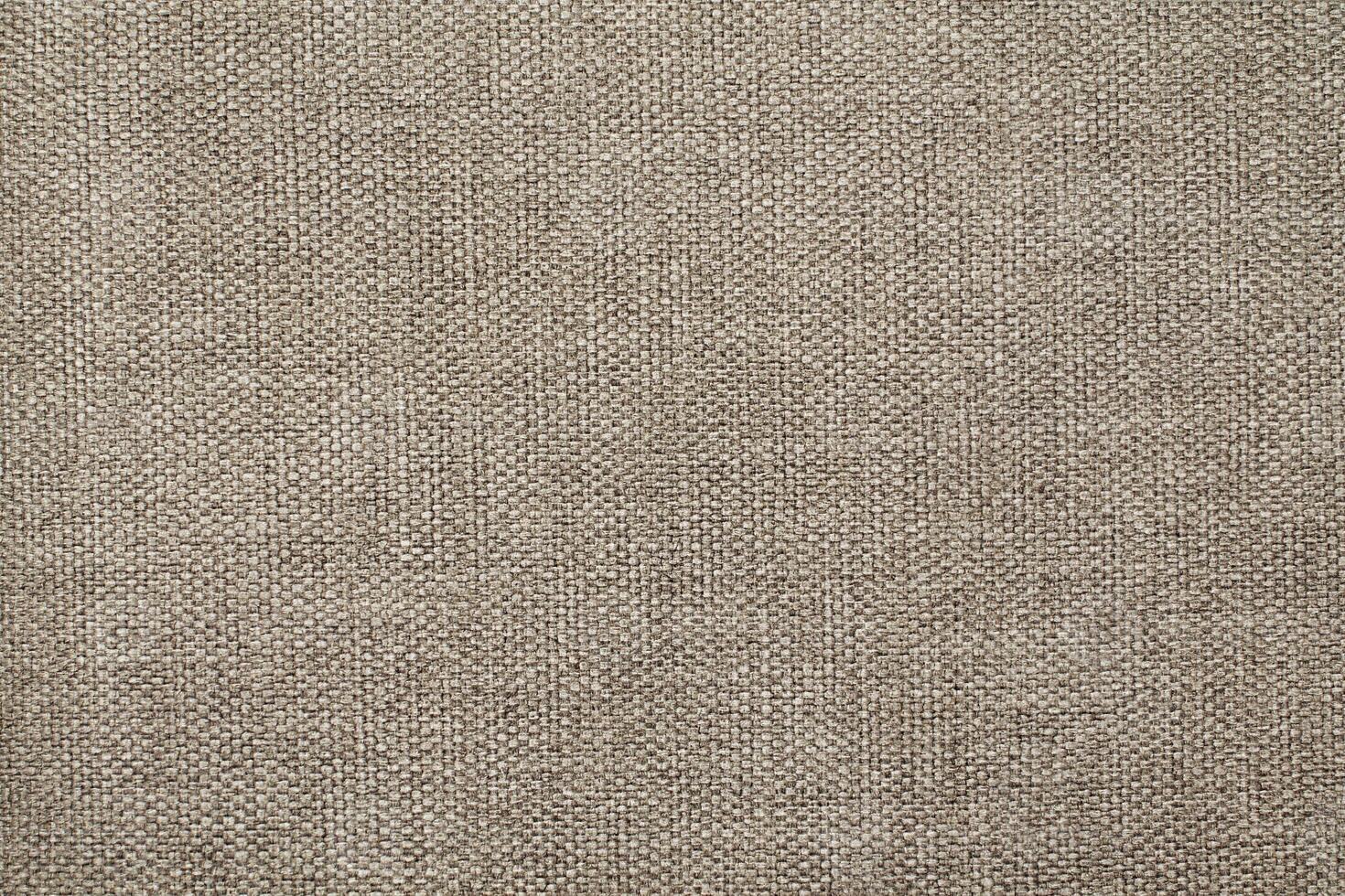 Natural Linen Material Textile Canvas Fabric Texture Background Close-up Detail of Fabric Natural Color Hemp Material Pattern Design Wallpaper. Can be Used as Background or For Graphic Design photo