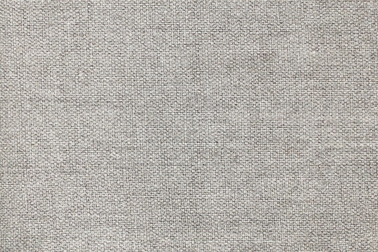 Natural Linen Material Textile Canvas Fabric Texture Background Close-up Detail of Fabric Natural Color Hemp Material Pattern Design Wallpaper. Can be Used as Background or For Graphic Design photo