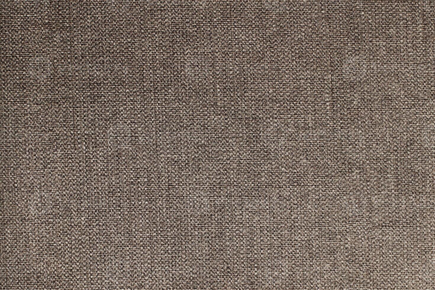Natural Linen Material Textile Canvas Fabric Texture Background Close-up Detail of Fabric Natural Color Hemp Material Pattern Design Wallpaper. Can be Used as Background or For Graphic Design photo