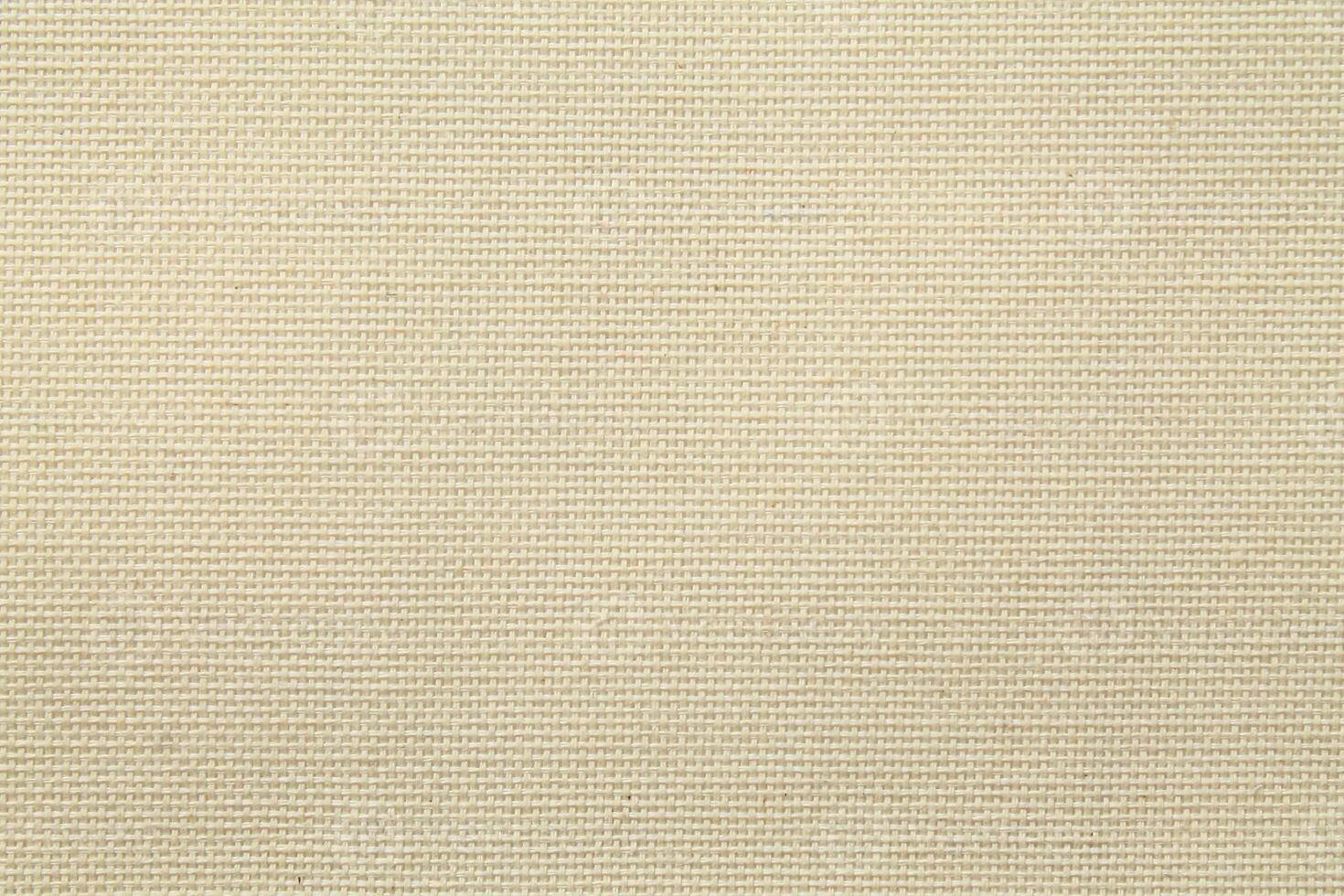 Natural Linen Material Textile Canvas Fabric Texture Background Close-up Detail of Fabric Natural Color Hemp Material Pattern Design Wallpaper. Can be Used as Background or For Graphic Design photo