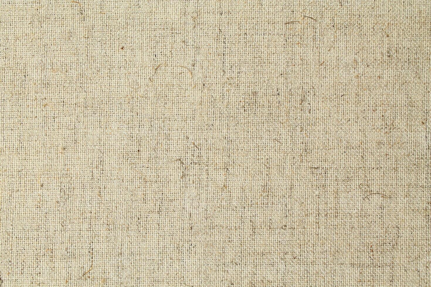 Natural Linen Material Textile Canvas Fabric Texture Background Close-up Detail of Fabric Natural Color Hemp Material Pattern Design Wallpaper. Can be Used as Background or For Graphic Design photo