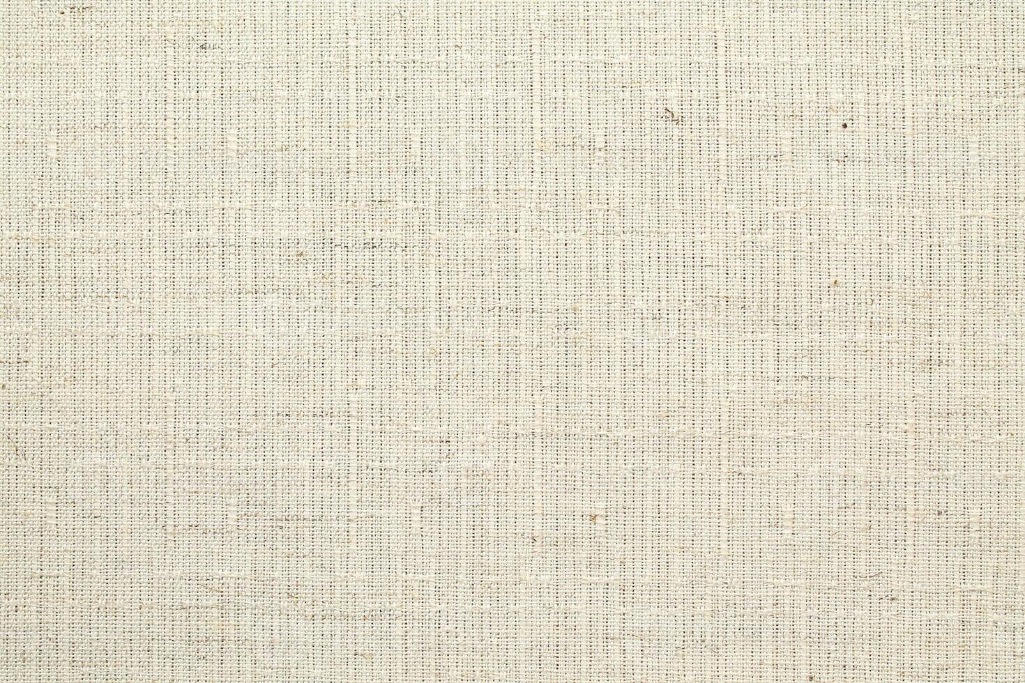 Natural Linen Material Textile Canvas Fabric Texture Background Close-up Detail of Fabric Natural Color Hemp Material Pattern Design Wallpaper. Can be Used as Background or For Graphic Design photo