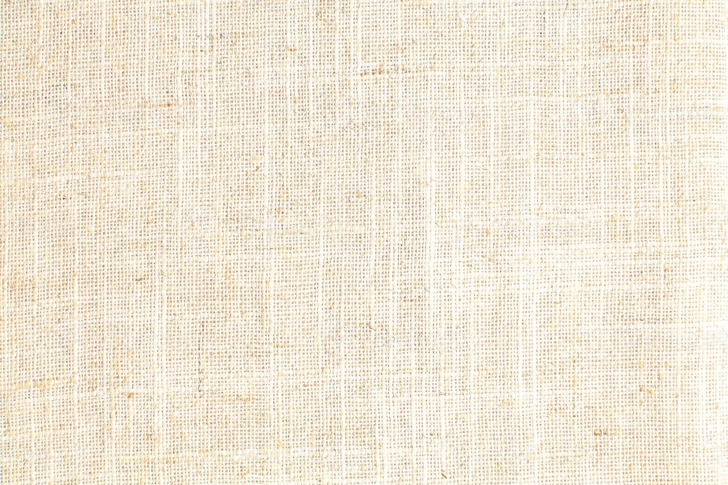 Natural Linen Material Textile Canvas Fabric Texture Background Close-up Detail of Fabric Natural Color Hemp Material Pattern Design Wallpaper. Can be Used as Background or For Graphic Design photo