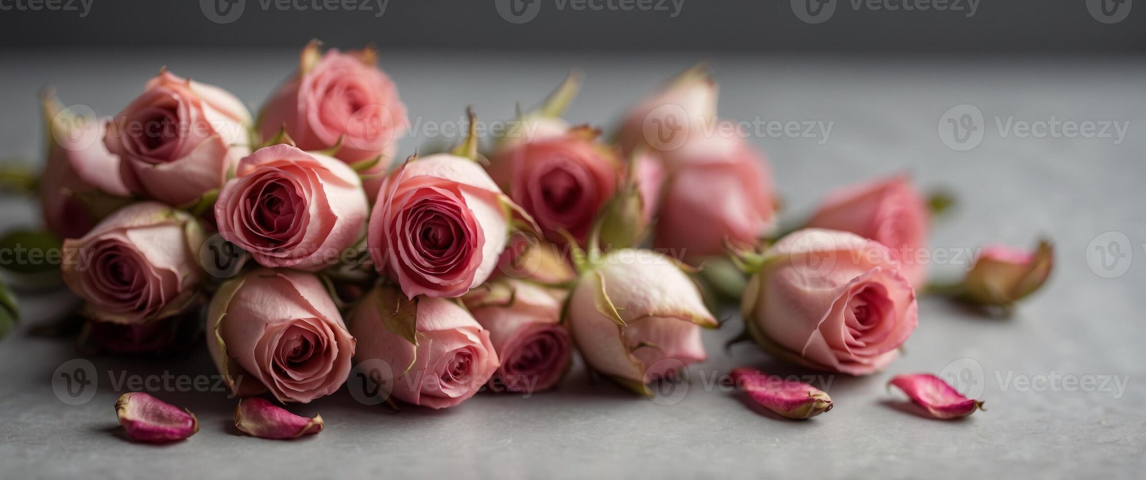 Dry pink rose buds in the spoon Herbal tea. photo