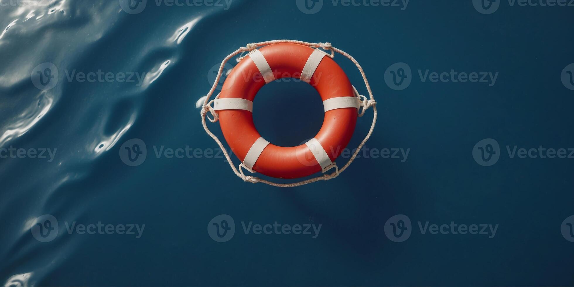 Top view of lifebuoy floating on top blue water. photo