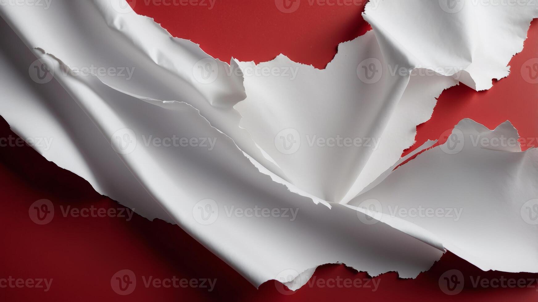 Torn white paper with ragged edges and red background Copy space. photo