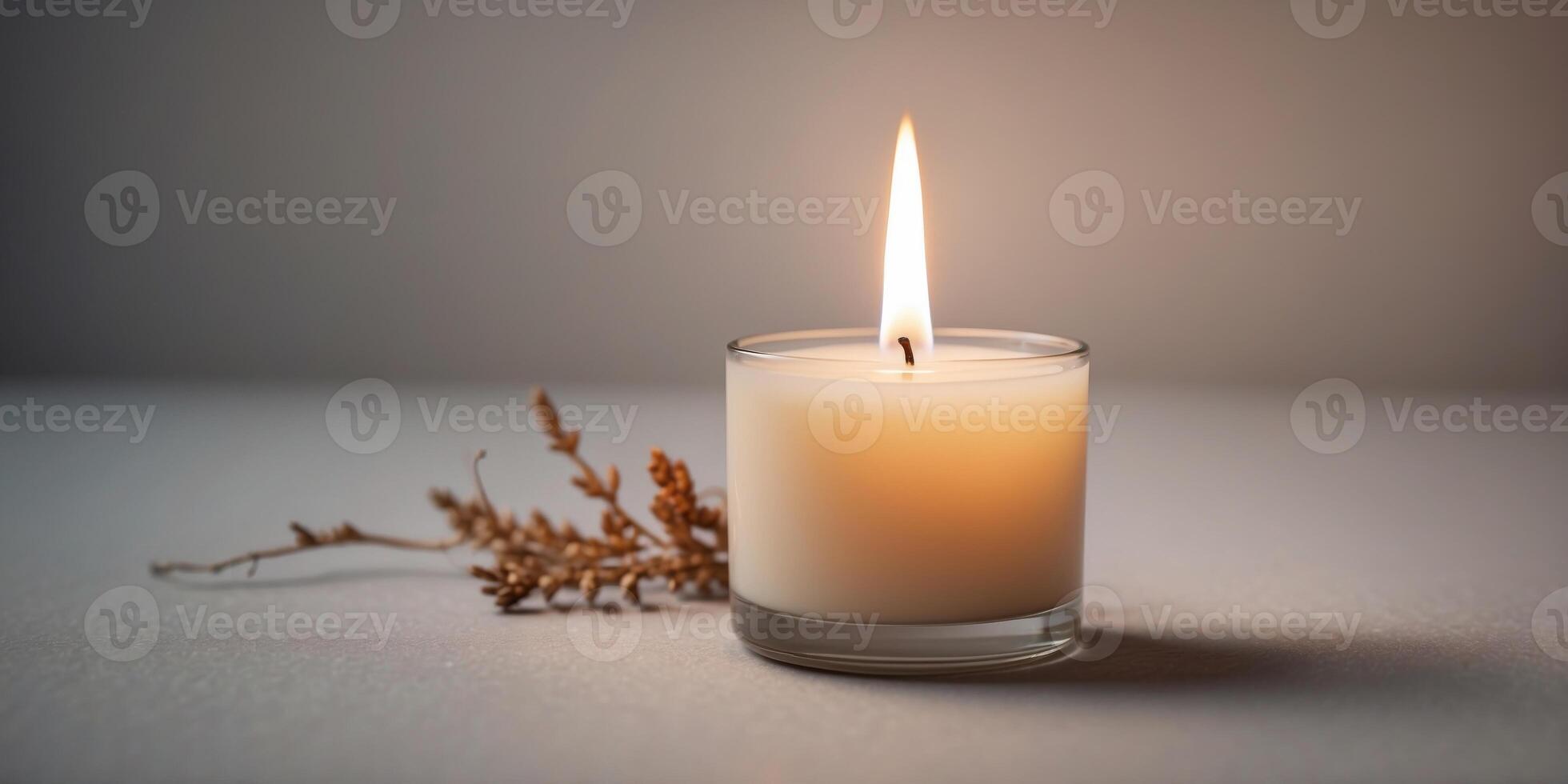 Burning candle with white empty label close-up. photo