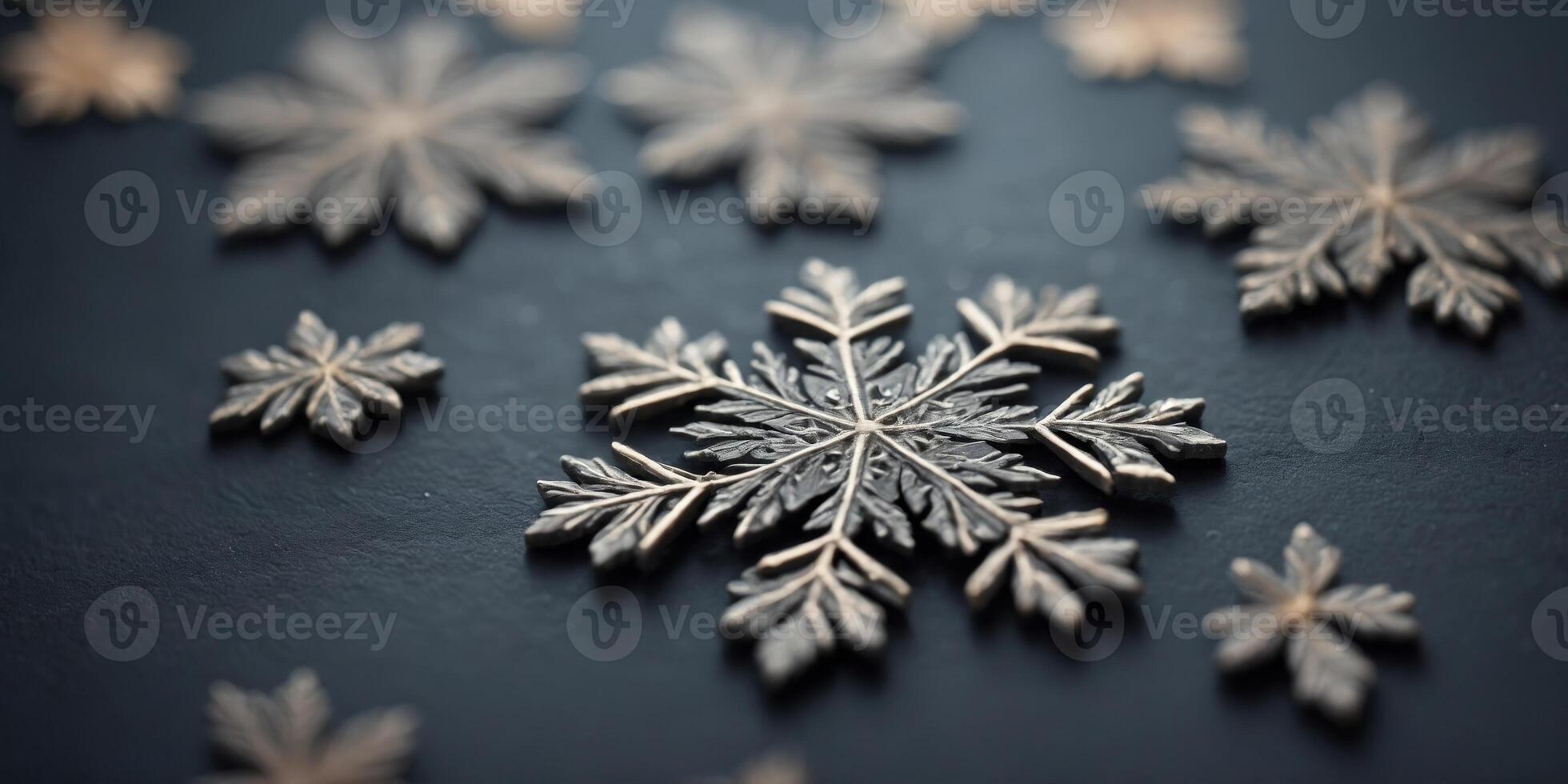 Slate gray background with snowflake designs. photo