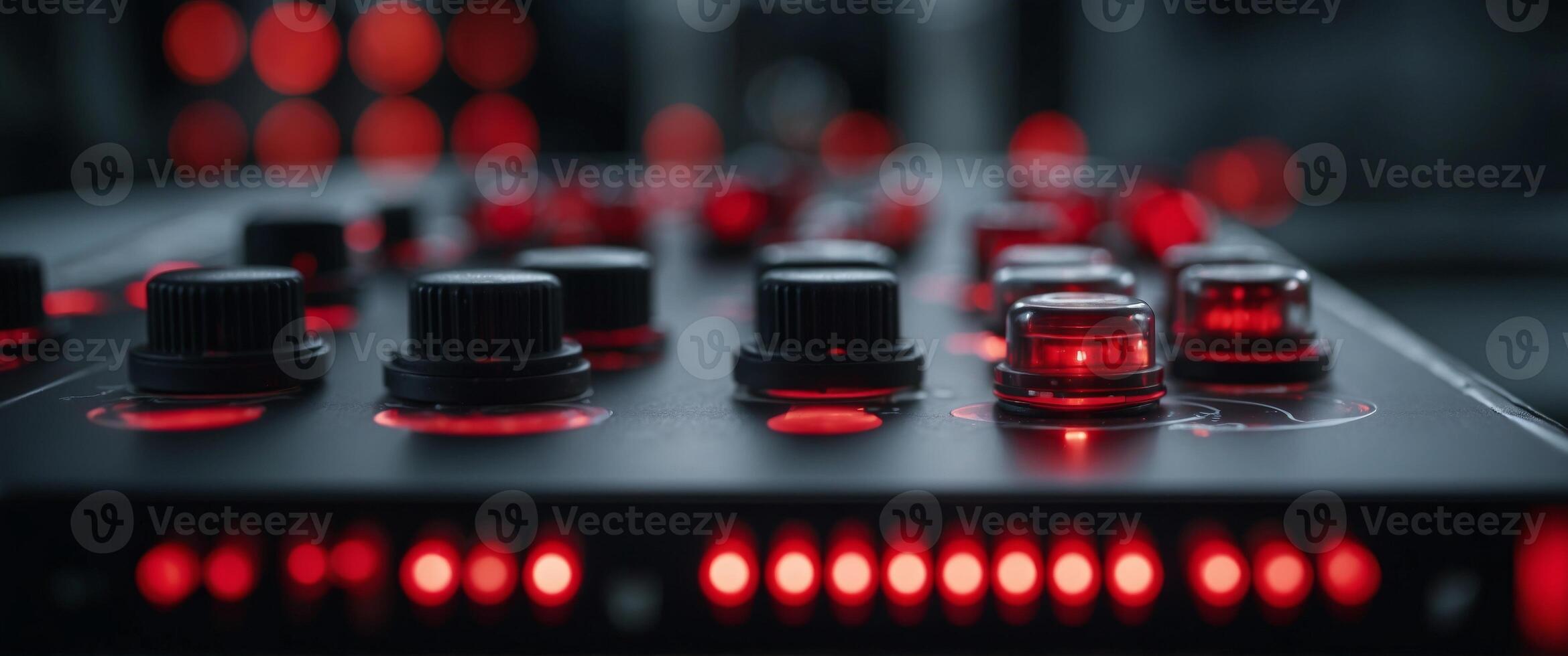 Close-up of a control panel with red switches and glowing lights in a modern industrial facility. photo