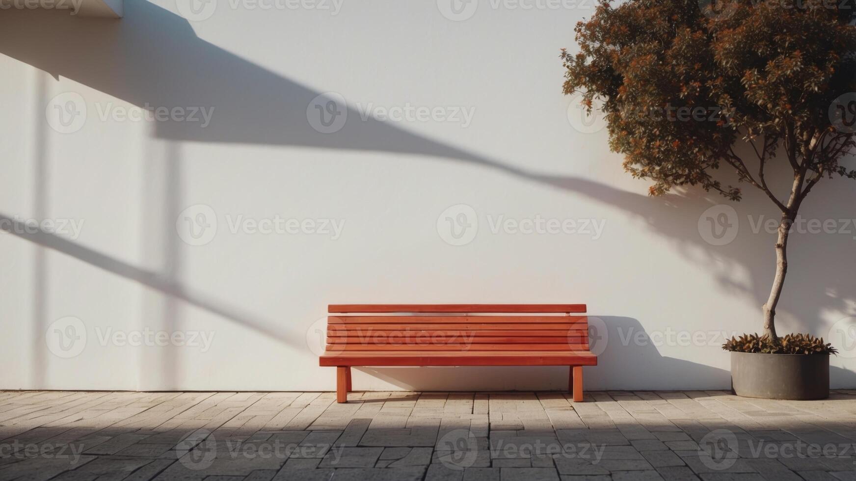 A white wall alongside a bench in the middle of it. photo