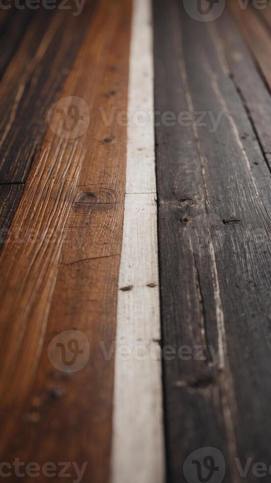 A close up of a wooden floor with a white line running down the middle. photo