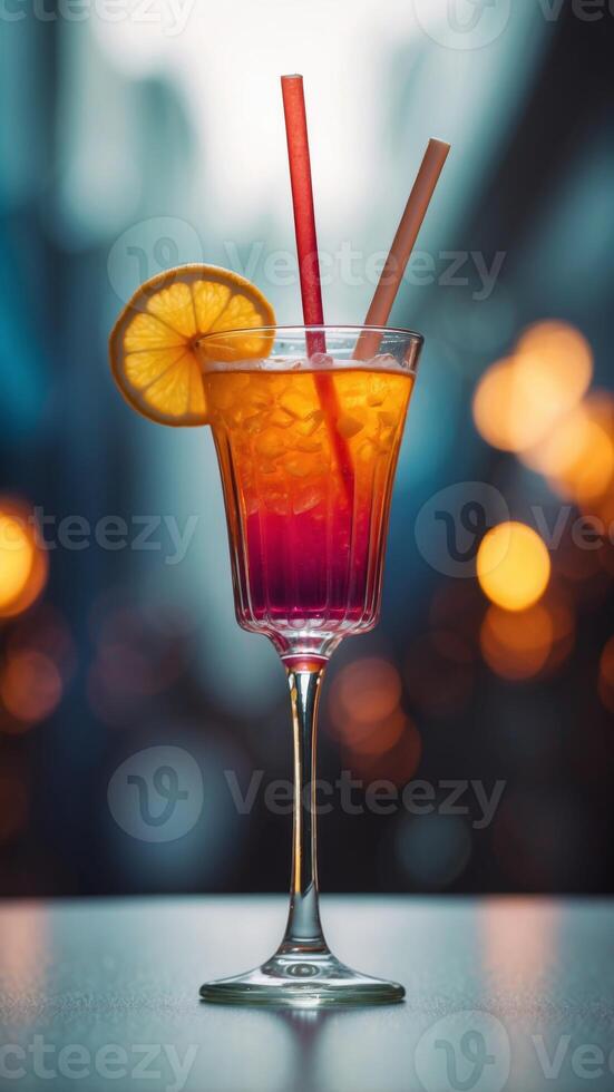A glass of a colorful drink with a straw in it. photo