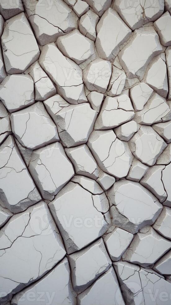 A white marble wall with cracks and holes. photo