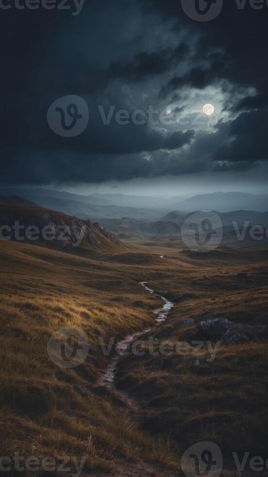 epic gloomy landscape close up moonlight breaks through heavy clouds and illuminates sections of the gloomy valley. photo