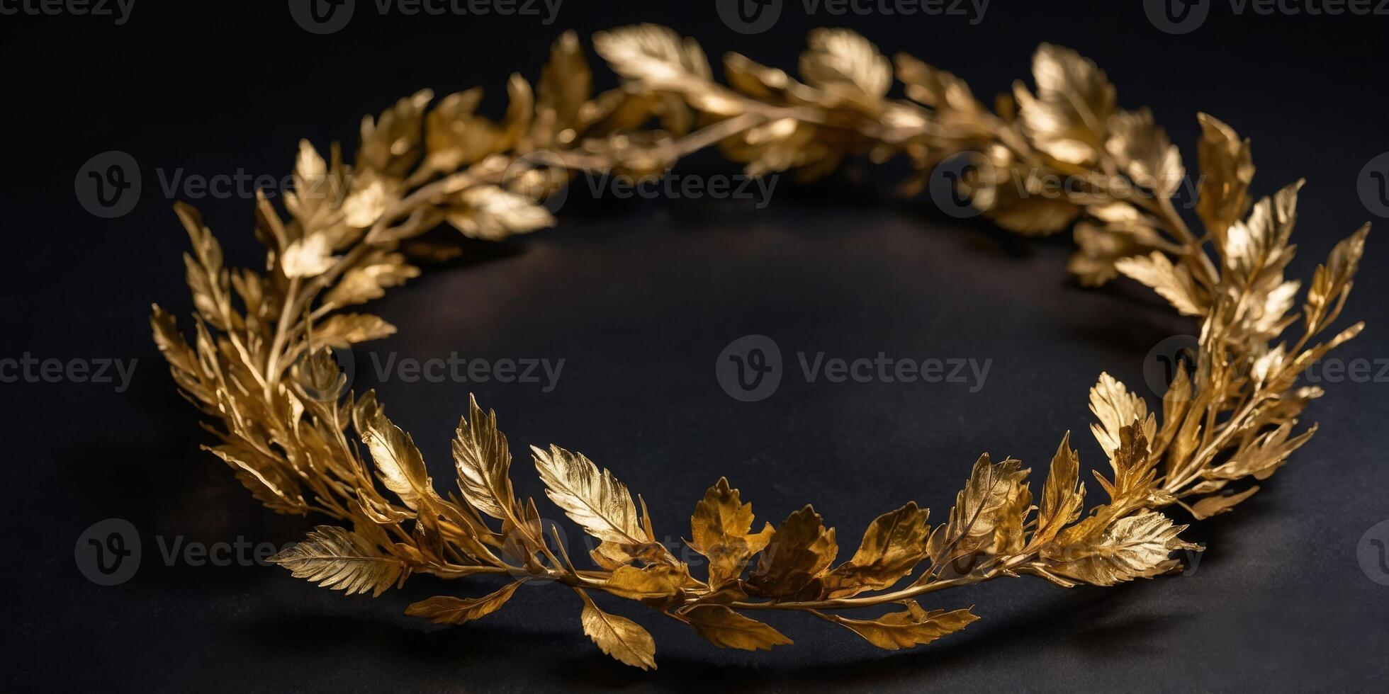 A gold leaf wreath is displayed on a black background. photo