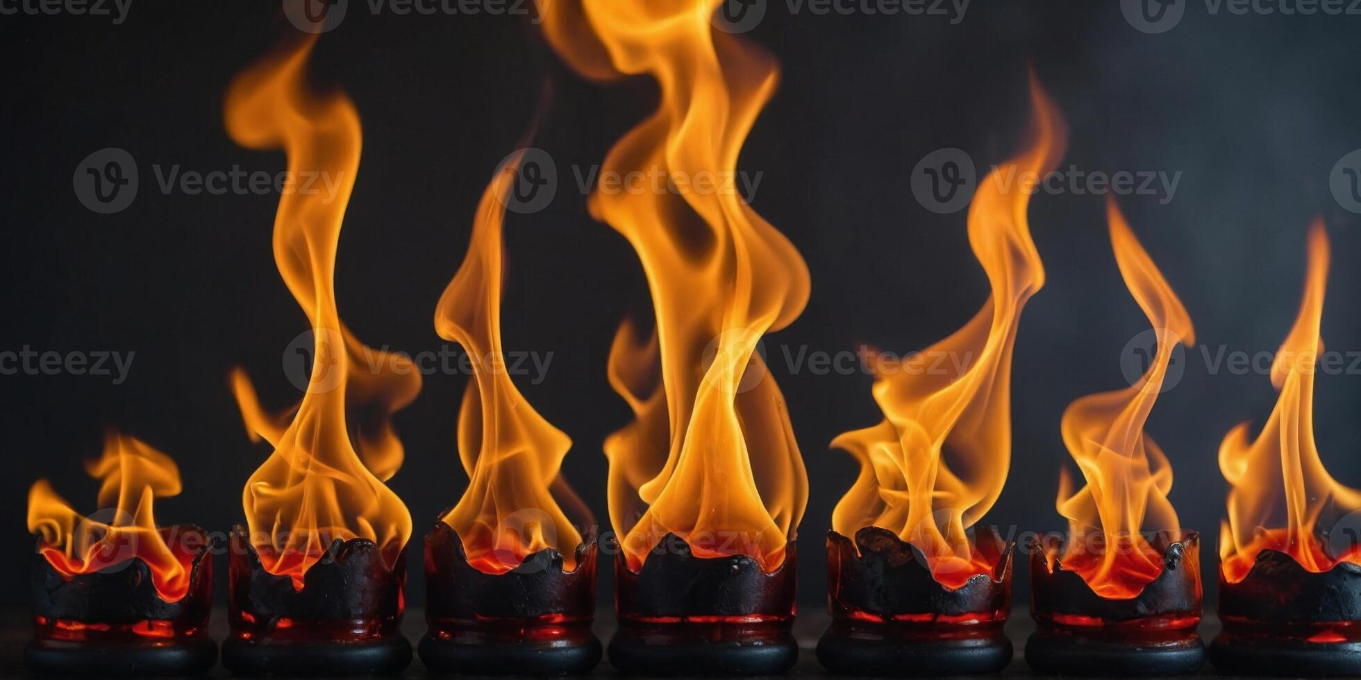 A series of flames are shown in different positions and sizes. photo