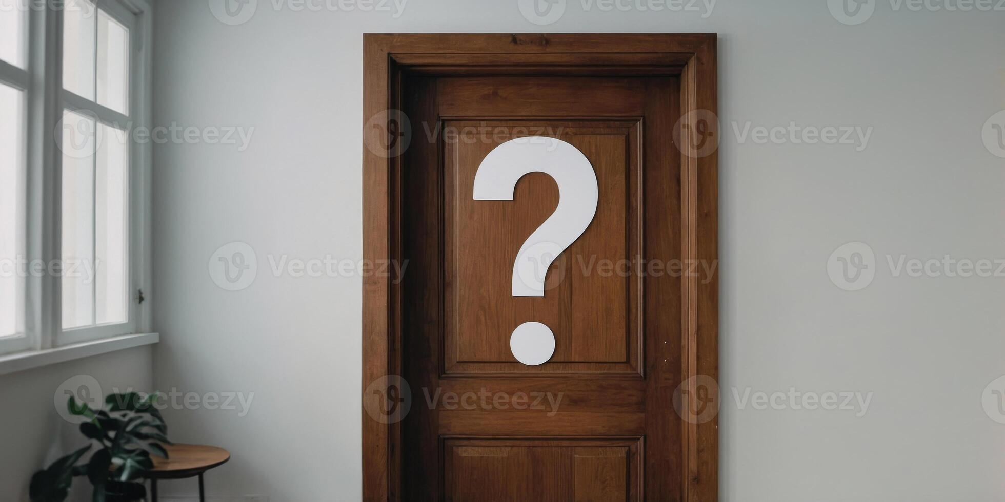 A wooden door with a question mark on it is in a room with a white wall. photo