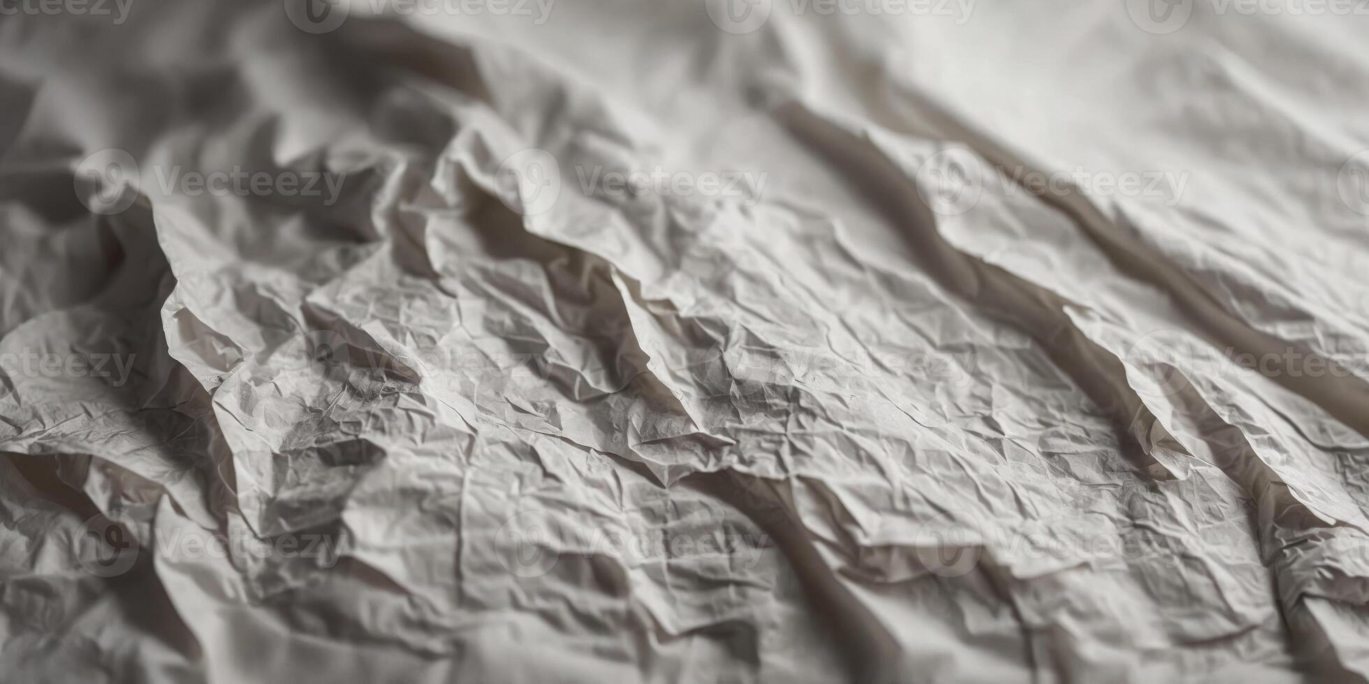 A white paper with a lot of wrinkles and creases. photo