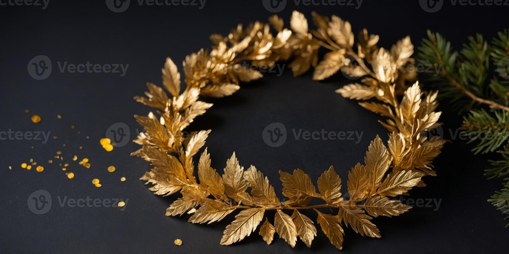 A gold leaf wreath is displayed on a black background. photo