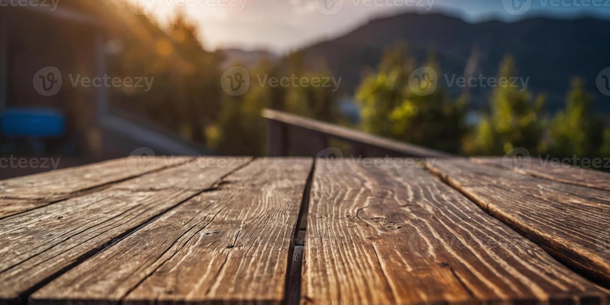 A wooden table with a view of the outside. photo