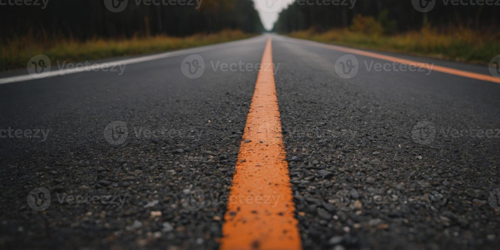 A close up of a road with a white line and orange stripe. photo