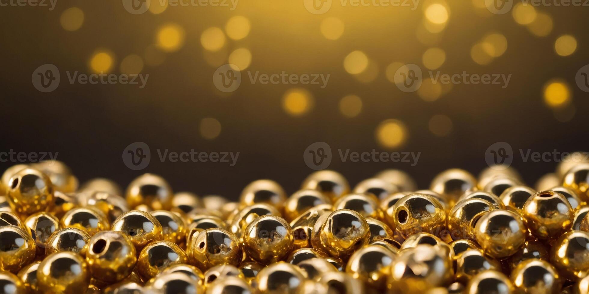 A pile of gold beads on a yellow background. photo