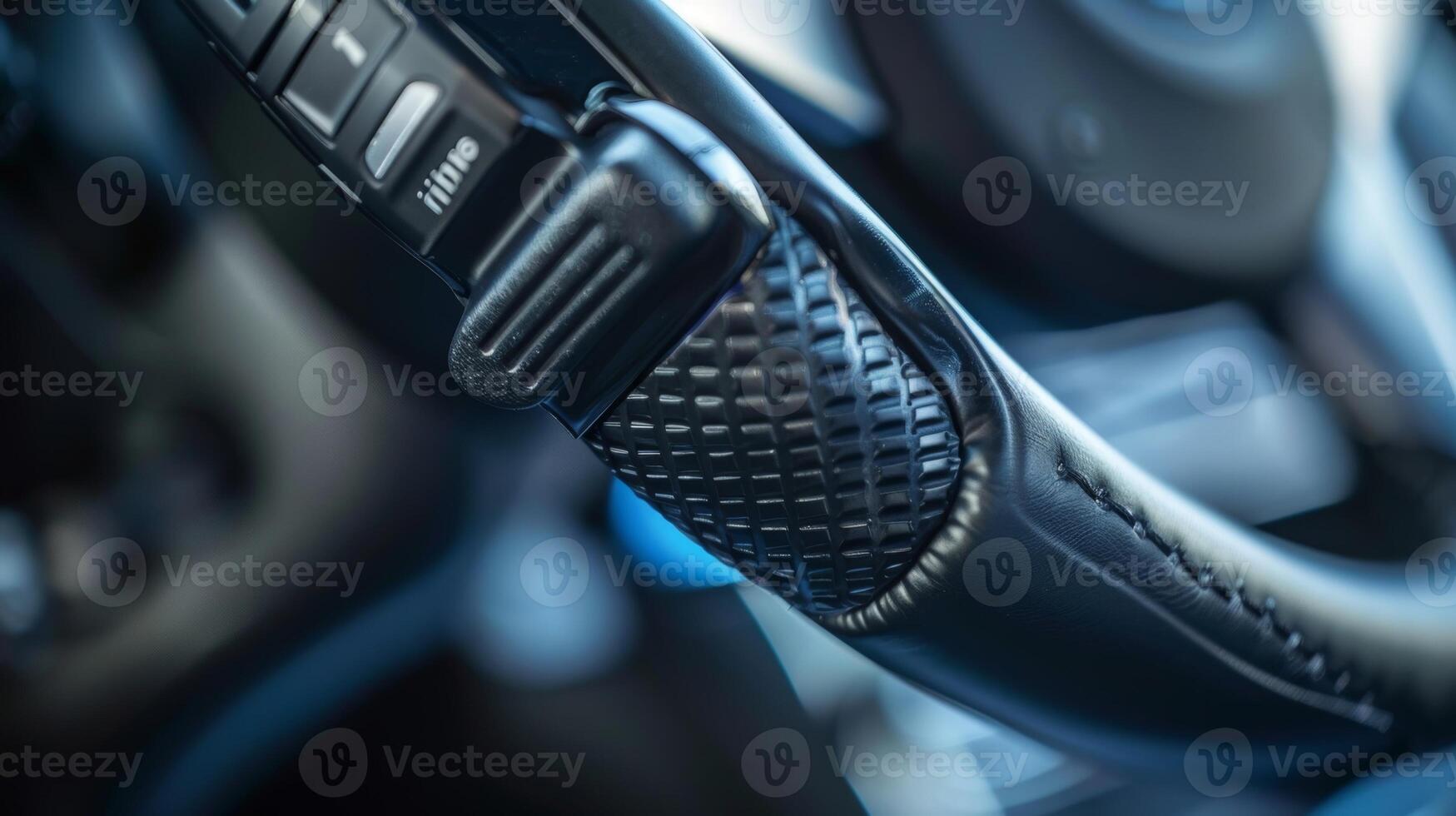 A low angle shot of a parking brake lever showcasing its textured and ergonomic grip for easy use photo