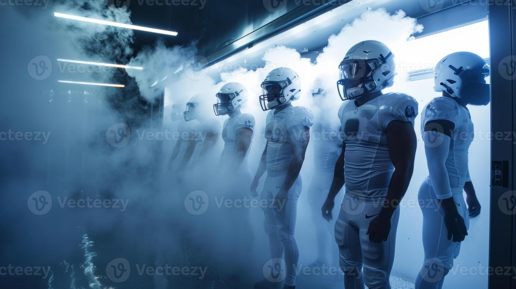 A group of football players standing in a line each taking turns standing in a cryotherapy chamber with liquid nitrogen vapor surrounding their bodies photo