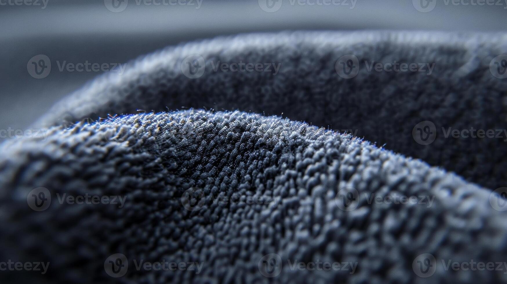 An extreme closeup of a car covers microfiber material known for its softness and gentle touch on the cars surface photo