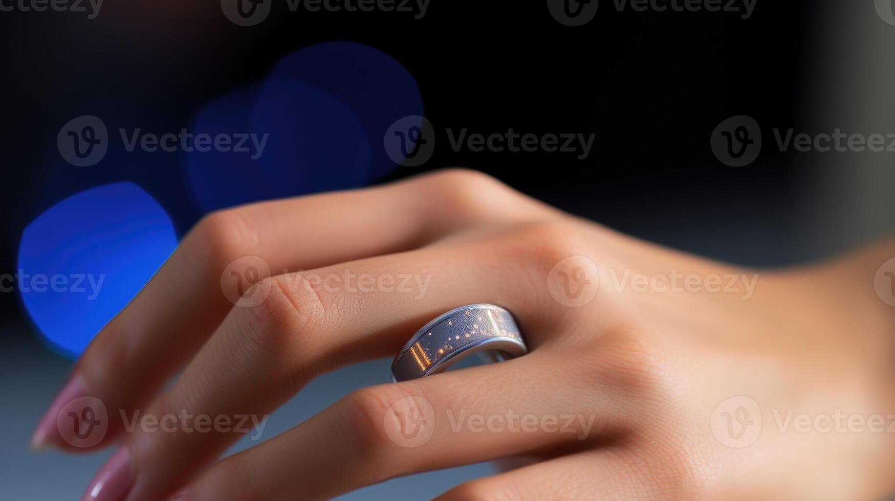 Closeup of a finger wearing a biometric ring for tracking health data. photo