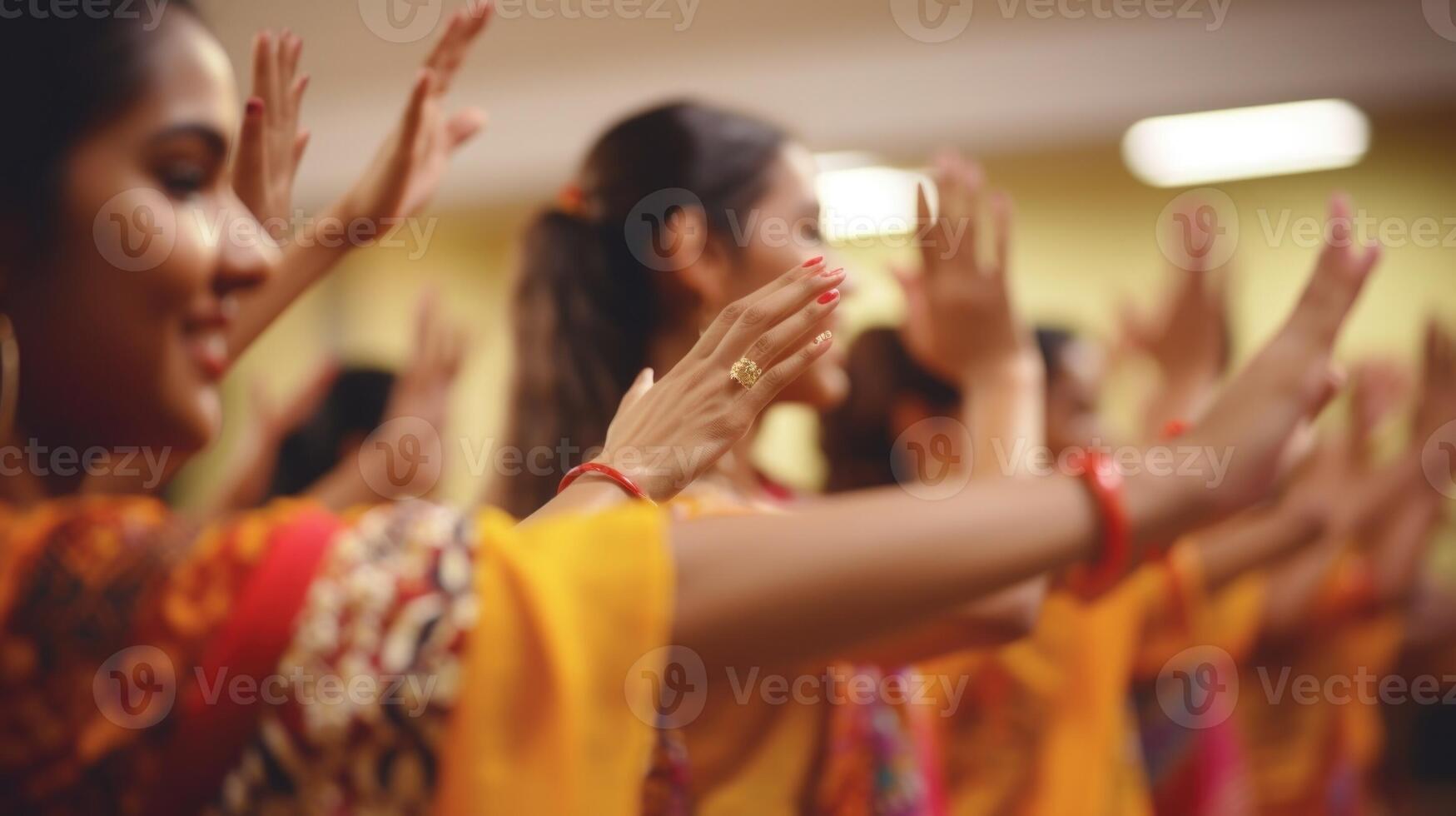 Closeup of synchronized hand gestures during a traditional dance lesson photo
