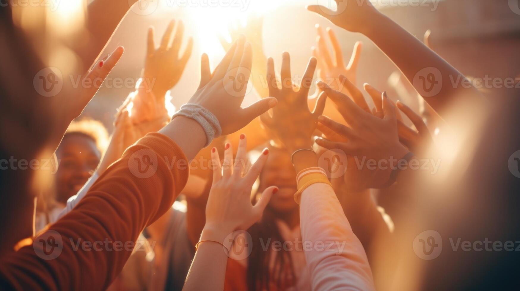 Closeup of a diverse group of hands highfiving after a successful game. photo