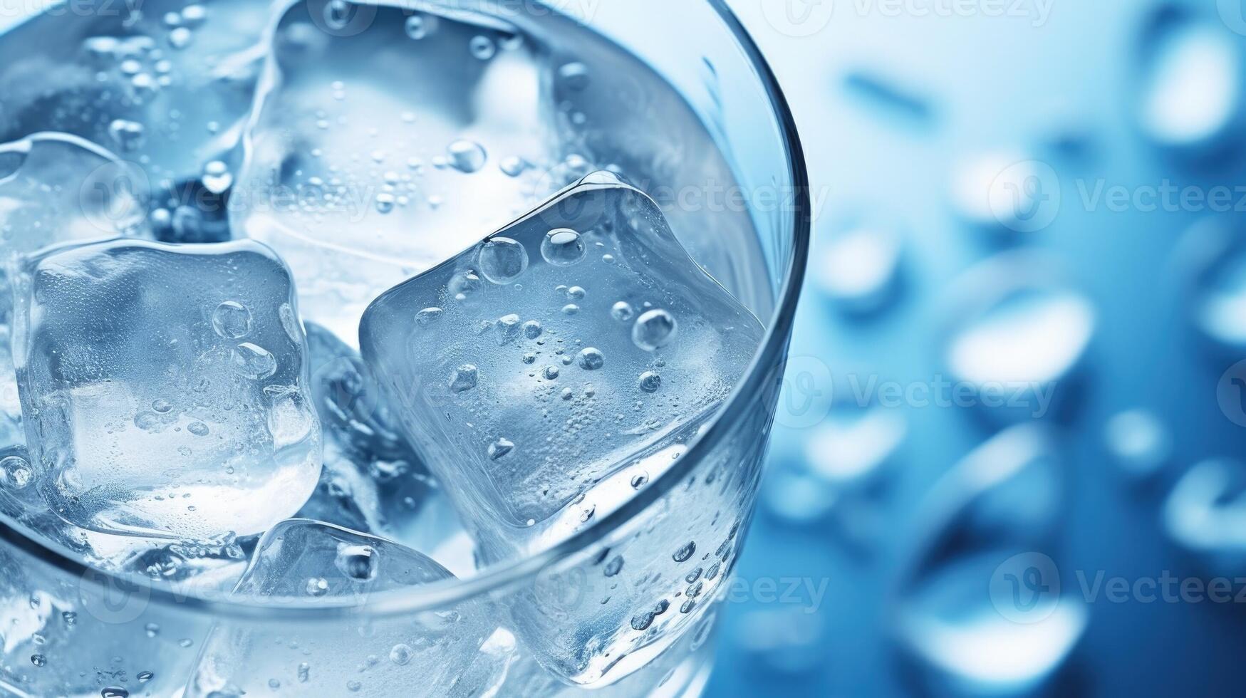 Closeup of a refreshing glass of cold, clear water with ice cubes photo