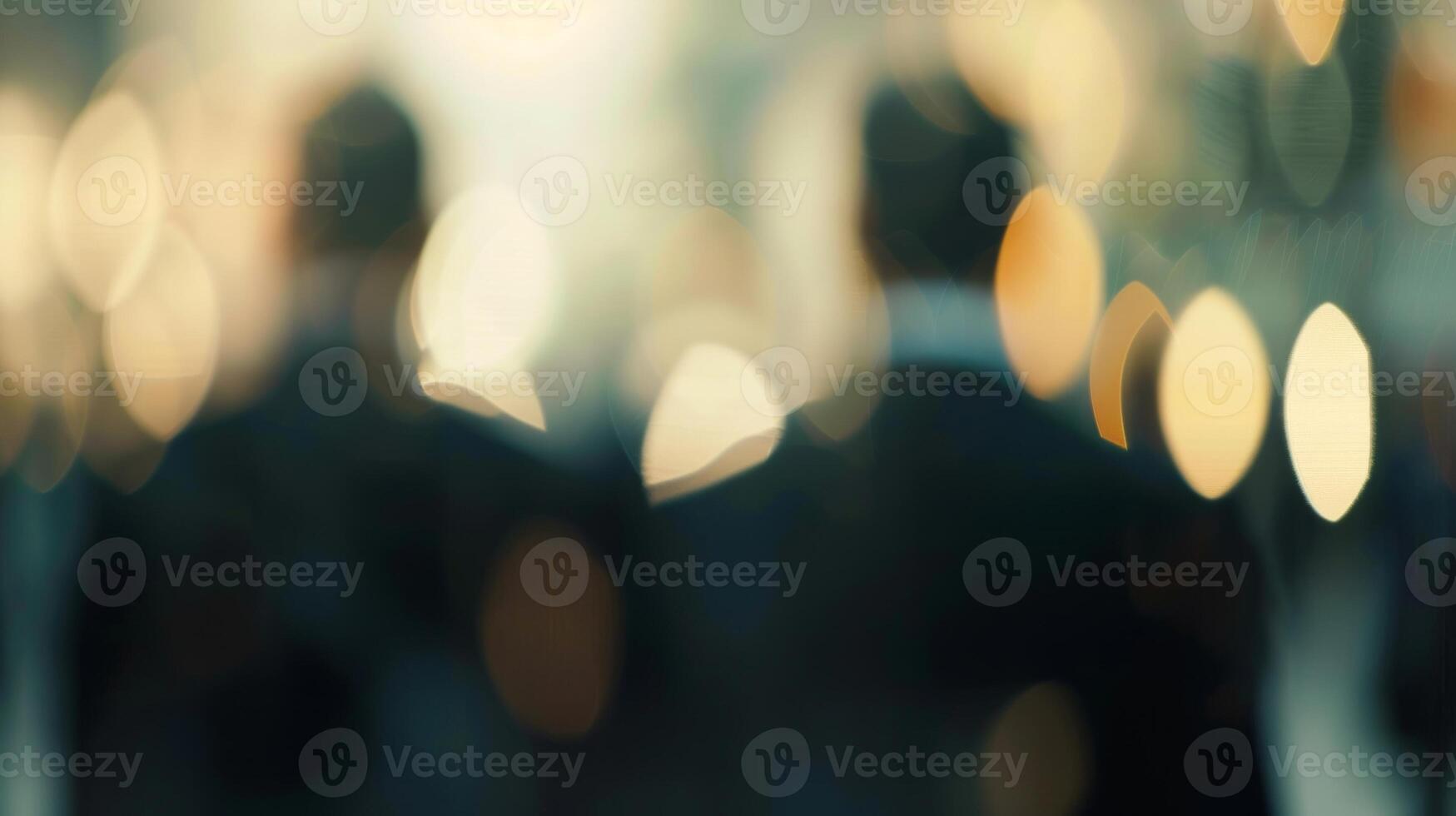 Shapes in business suits blur together in a corporate discussion photo