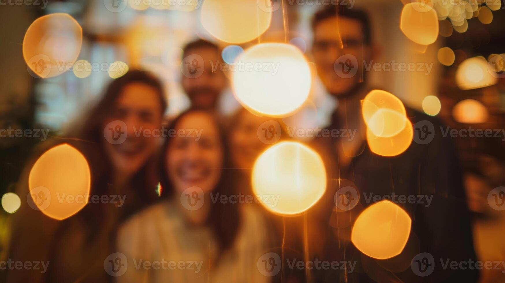 Blurry shapes of coworkers huddled together for a group photo at the office holiday party