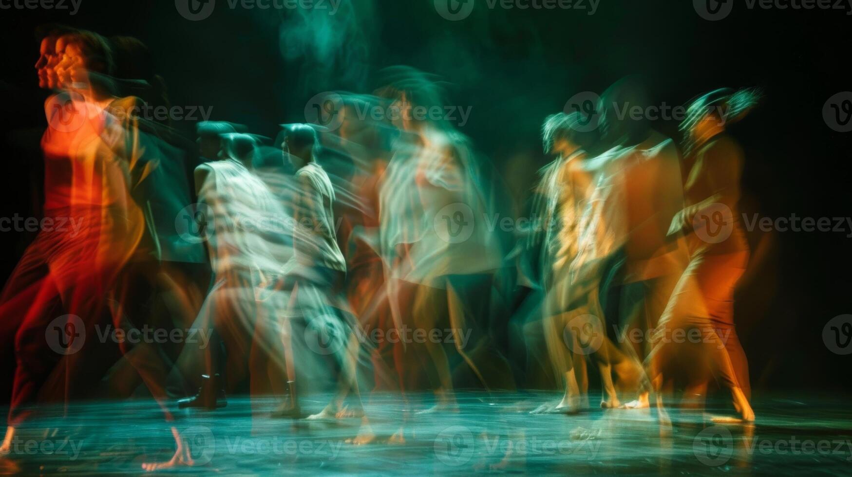 Blurry forms sway to the rhythm of the performance lost in the moment photo