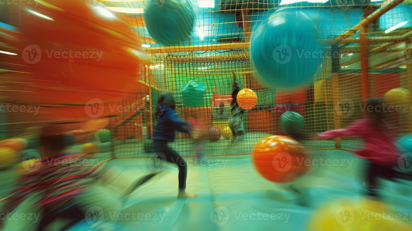 Dim blurred shapes of kids having a ball in a lively indoor play space photo