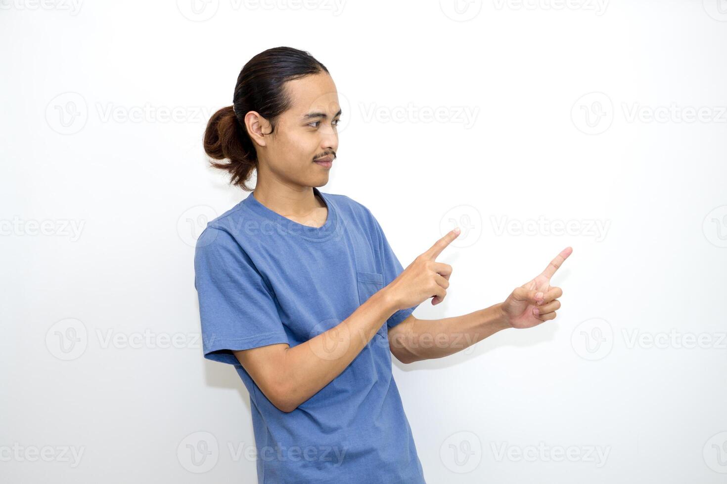 Asian man smiling with both hands pointing to the side. isolated on white background photo