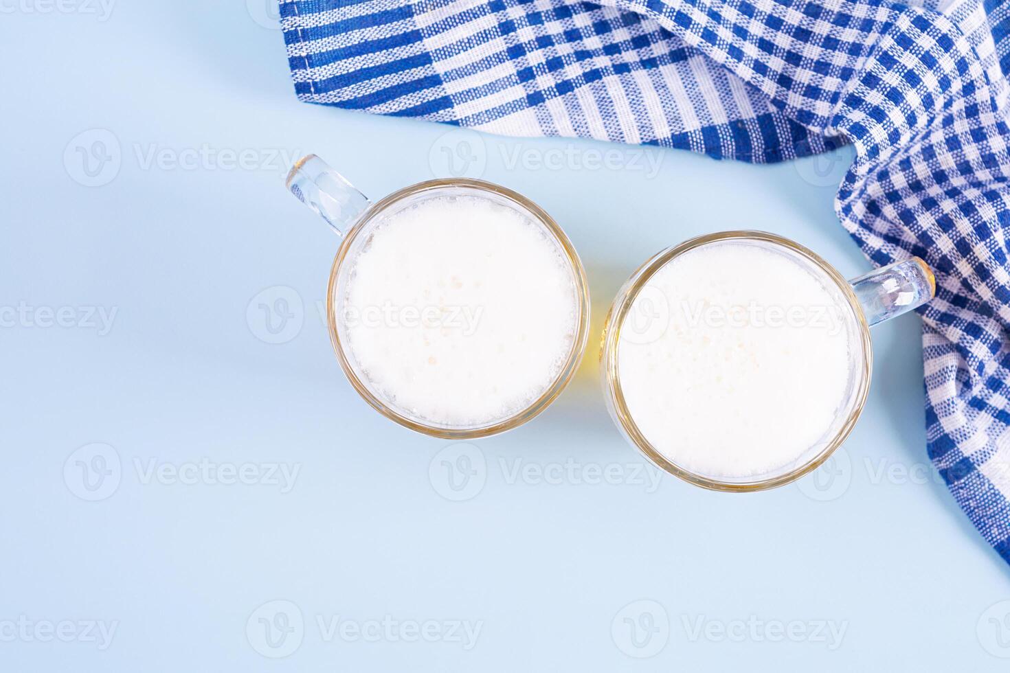 Oktoberfest background. Beer mug and Bavarian symbolic fabric photo