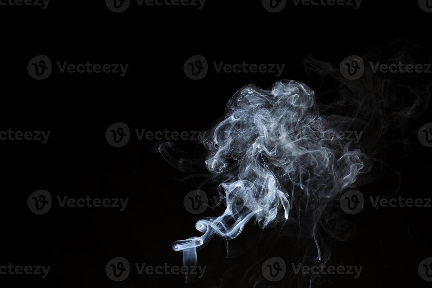 Smoke from flames or fog clouds graphic design art isolated on dark black background. photo