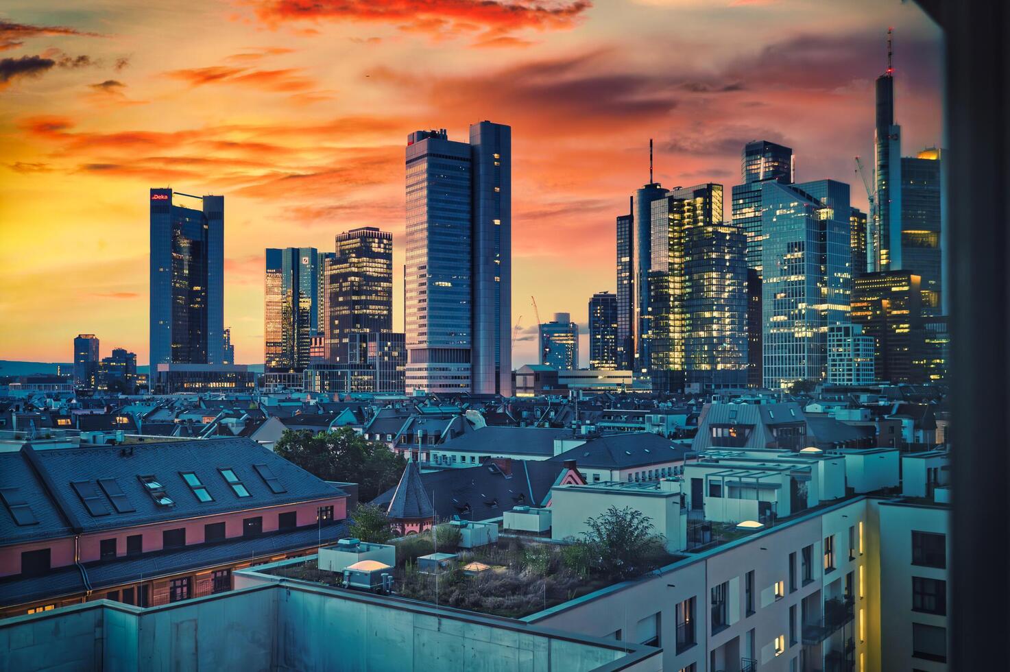 Frankfurt Skyline at Sunset, Modern Skyscrapers Illuminated Against a Vibrant Sky photo