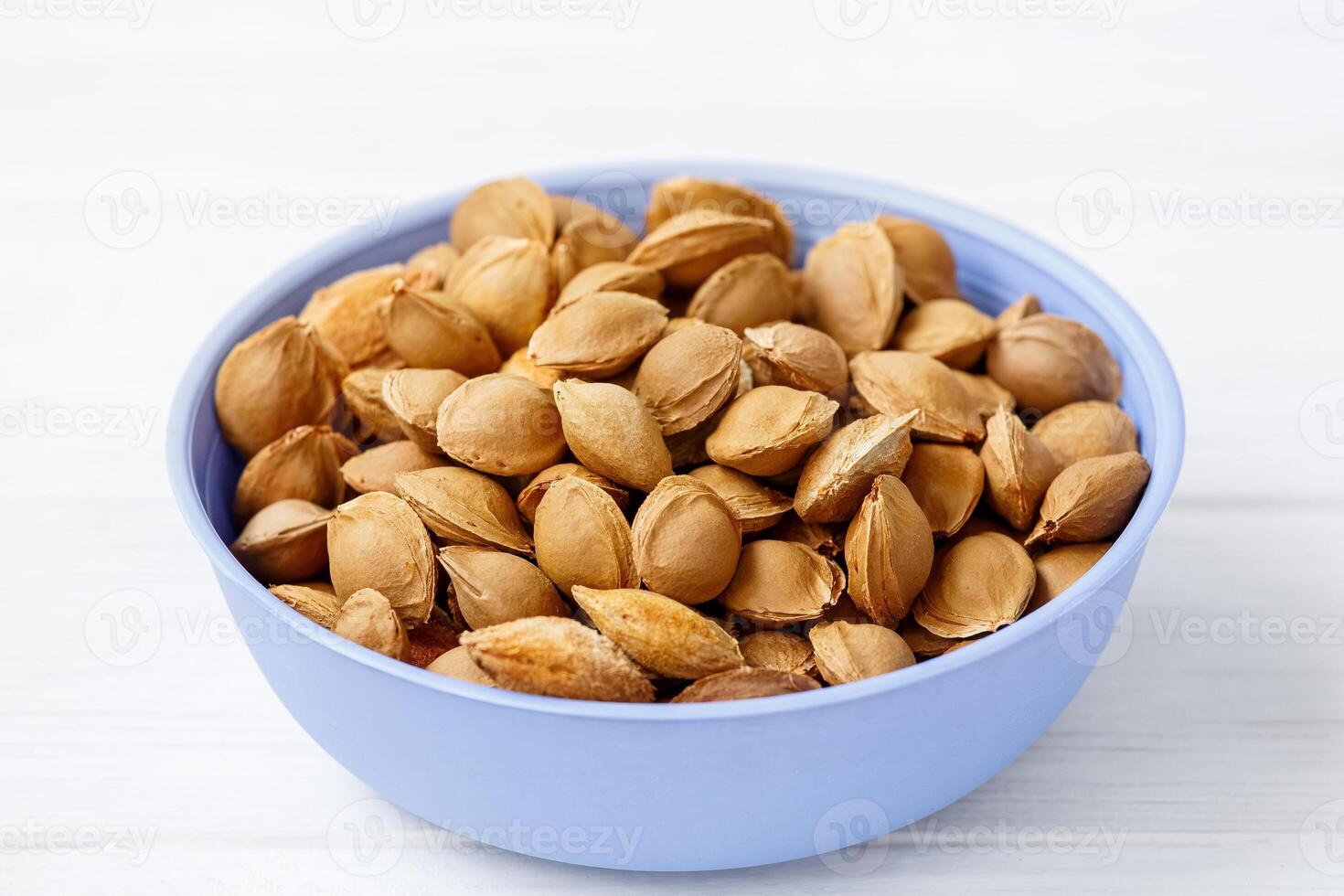 Apricot pits. Inside each apricot stone is a small treasure in the form of kernels. They are rich in minerals, proteins and contain a substance called amygdalin. photo